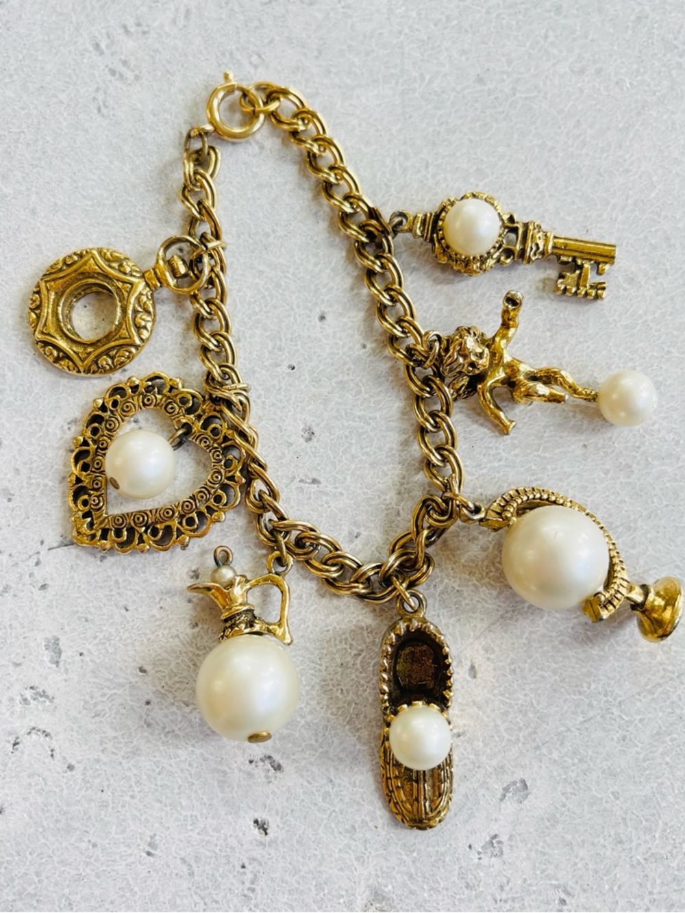Vintage CIRCO Gold Tone Charm Bracelet Faux Pearl Cherub Key Globe Shoe Charms